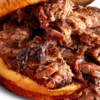 Texas Beef Brisket Sandwich · Piled high with hand-seasoned, hickory-smoked Texas Beef Brisket. . Served with choice of 1 ...