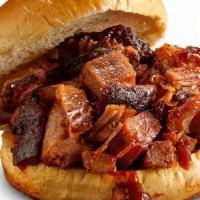 Georgia Chopped Pork Sandwich · Slow-smoked chopped pork topped with Rich & Sassy®. . Served with choice of 1 side and spicy...