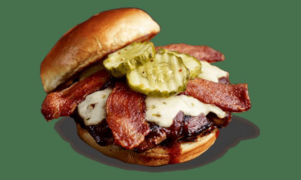 Devil's Spit® Burger* · Slathered with Devil’s Spit® BBQ sauce and topped with melted pepper-Jack cheese, bacon and spicy Hell-Fire Pickles. . Served with choice of 1 side and spicy Hell-Fire Pickles.