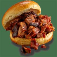 Kids' Georgia Chopped Pork Sandwich · Awared-winning, slow-smoked chopped pork topped with Rich & Sassy® on a toased bun.  Served ...