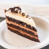 Triple Chocolate Cake · A chocolate cake layered with three chocolate mousses (milk, dark, ivory). Covered in tiny m...