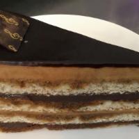 Opera Cake · Two layers of coffee mousses and two layers of chocolate ganache. Decorated with chocolate m...