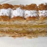 Napoleon · Crisp layers of puff pastry cream and decorated with powdered sugar.