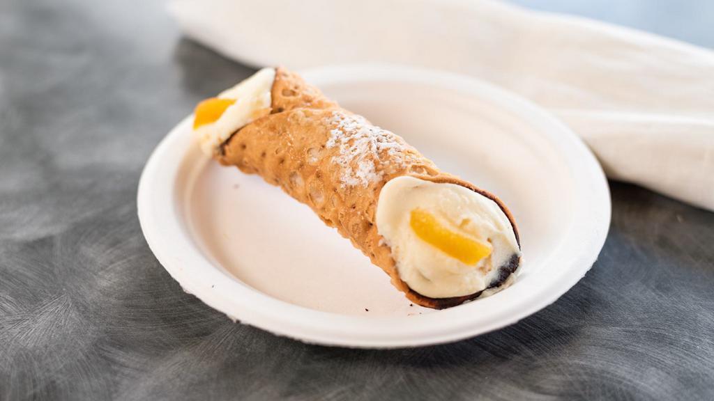 Cannoli · A chocolate coated pastry shell filled with a mix of ricotta, candied fruit and chocolate.