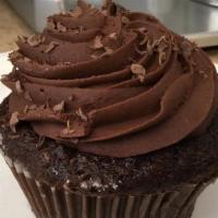 Chocolate Cupcake · Moist chocolate cake topped with swirls of rich chocolate frosting and sprinkled with rainbo...