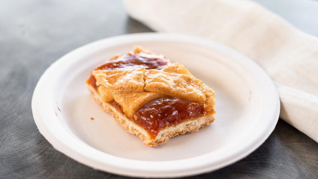 Apricot Bar · A buttery almond shortbread crust topped with an apricot marmalade covered by a lattice of almond shortbread.