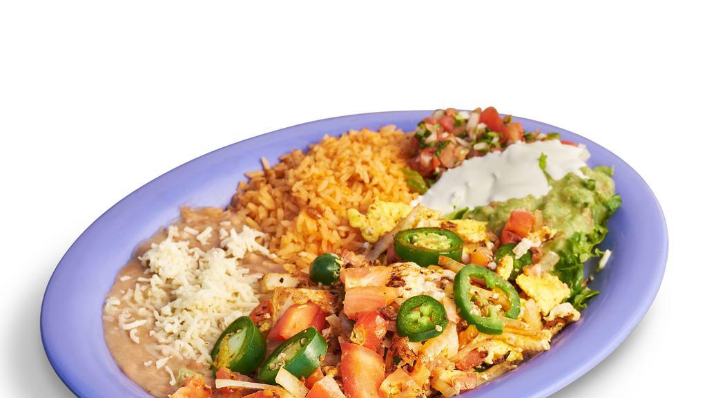 Huevos A La Mexicana Plate · Scrambled eggs with tomato, green bell peppers, onions, and jalapenos. Includes rice, beans, lettuce, guacamole, salsa, sour cream, cheese, and tortillas.