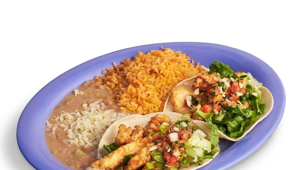 Fish Taco Plate · Two fish tacos with lettuce and pico de gallo. Served with rice and beans.