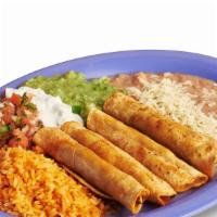 Flautas Plate · Includes rice, beans, lettuce, guacamole, salsa, sour cream, and cheese.