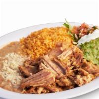 Carnitas Plate · Includes rice, beans, lettuce, guacamole, salsa, sour cream, cheese, and tortillas.