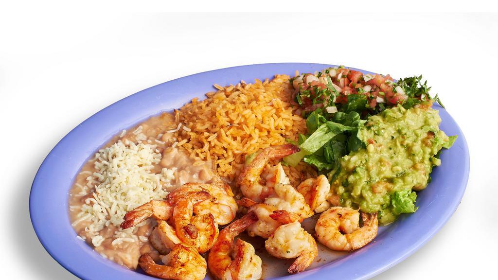 Camarones Al Mojo De Ajo Plate · Garlic shrimp. Served with rice, beans, guacamole, lettuce, salsa, and tortillas.
