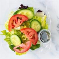 House Green Salad · Organic spring mix salad w/ persian cucumbers and fresh tomatoes. Balsamic dressing on the s...