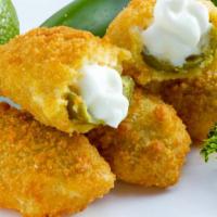 Jalapeno Poppers · Crispy deep fried jalapeno poppers made with warm cream cheese.