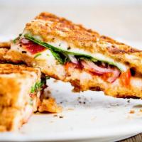 Panzanella (Vegetarian) Panini · Hot off the panini press! Comes with avocado, spinach, tomatoes, sliced cucumbers, balsamic ...