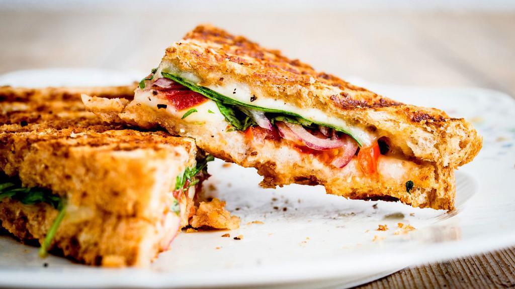 Panzanella (Vegetarian) Panini · Hot off the panini press! Comes with avocado, spinach, tomatoes, sliced cucumbers, balsamic vinegar, and pepper jack cheese.