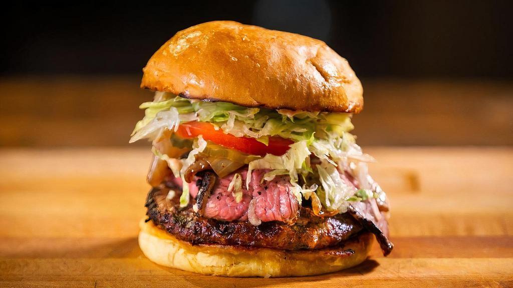 Tri Tip Burger · Beef patty + Tri Tip, & Red Ranch sauce.. Made with lettuce, tomato, onion, & pickles.