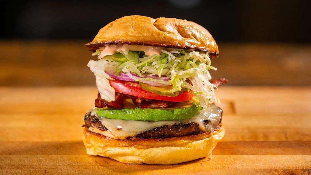 California Burger · Avocado, bacon, Swiss cheese, & sweet sauce.. Made with lettuce, tomato, onion, & pickles.