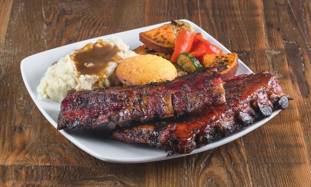 Black Pepper Baby Back Ribs Platter · Pork baby back ribs double smoked with sweet habanero vinegar glaze, served with 2 sides and choice of bread.