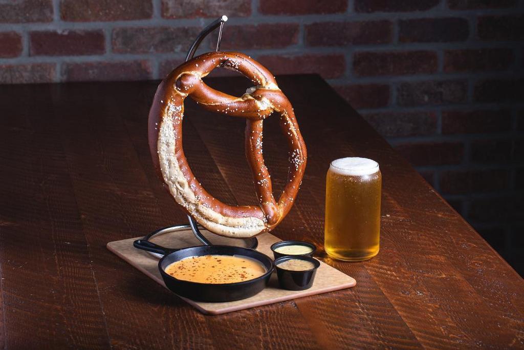 Giant Bavarian Pretzel · Giant Bavarian Pretzel served with beer cheese sauce & 2 types of mustard.