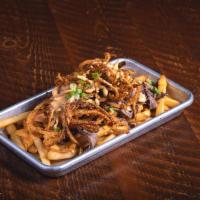 Tri Tip Beer Cheese Fries · Tri Tip, beer cheese sauce, Roadhouse Onions, & green onions.