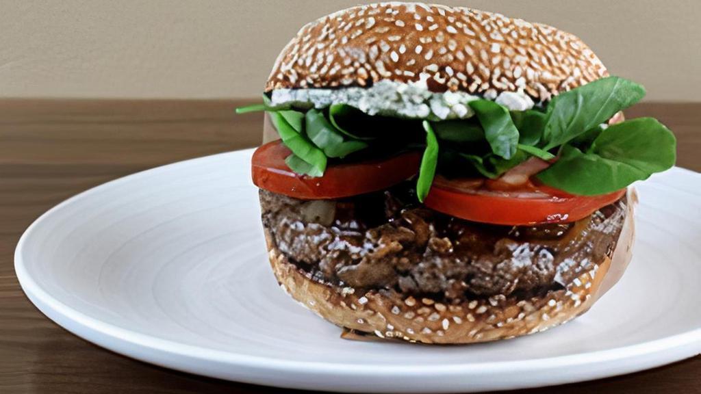Pacific Blue · Blue Cheese Spread, Greens, Tomato, Caramelized Onions, and Steak Sauce.