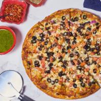 Greek Sheek Pizza · Feta, black olives, red onions and tomatoes on our walnut pesto.