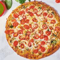 Pesto Spinach Pizza · Organic spinach, garlic, walnut pesto, feta cheese, tomatoes and mozzarella.