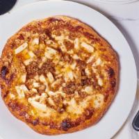 Apple-Walnut Pizza · Fresh, diced apples, and walnut cinnamon crumble on a sweet cheesy apricot base.