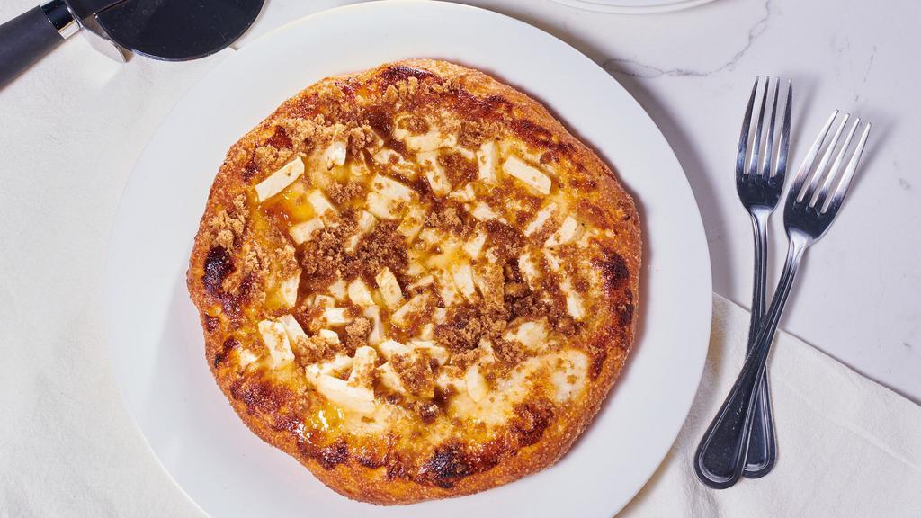 Apple-Walnut Pizza · Fresh, diced apples, and walnut cinnamon crumble on a sweet cheesy apricot base.