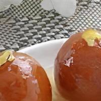 Gulab Jamun · Indian dessert of fried dough balls that are soaked in a sweet, sticky sugar syrup.