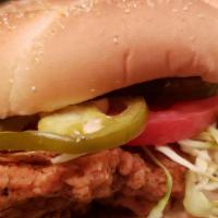 THE SUCIO · Fried Chicken Breast on a Soft Bun, with pickled Jalapenos, Tomato, Red Onions,shredded Cabb...