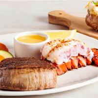 Victoria's Filet® Mignon* & Lobster · A tender and juicy thick-cut filet paired with a steamed lobster tail. Served with a choice ...