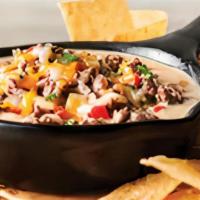Three Cheese Steak Dip · Blend of steak, Gouda, Parmesan and Jack cheeses, red bell peppers and onions. Served with t...