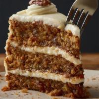 Triple-Layer Carrot Cake** · Moist layers of carrot cake with coconut and pecans topped with a sweet vanilla cream cheese...