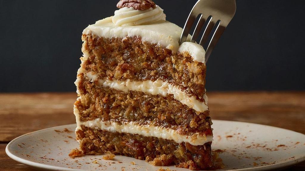 Triple-Layer Carrot Cake** · Moist layers of carrot cake with coconut and pecans topped with a sweet vanilla cream cheese icing.