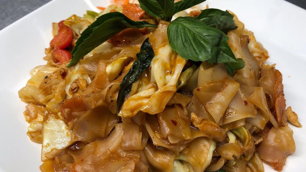Drunken Noodle · Spicy flat rice noodles, garlic and chili sauce, tomatoes, onion, bell pepper and basil leaves.