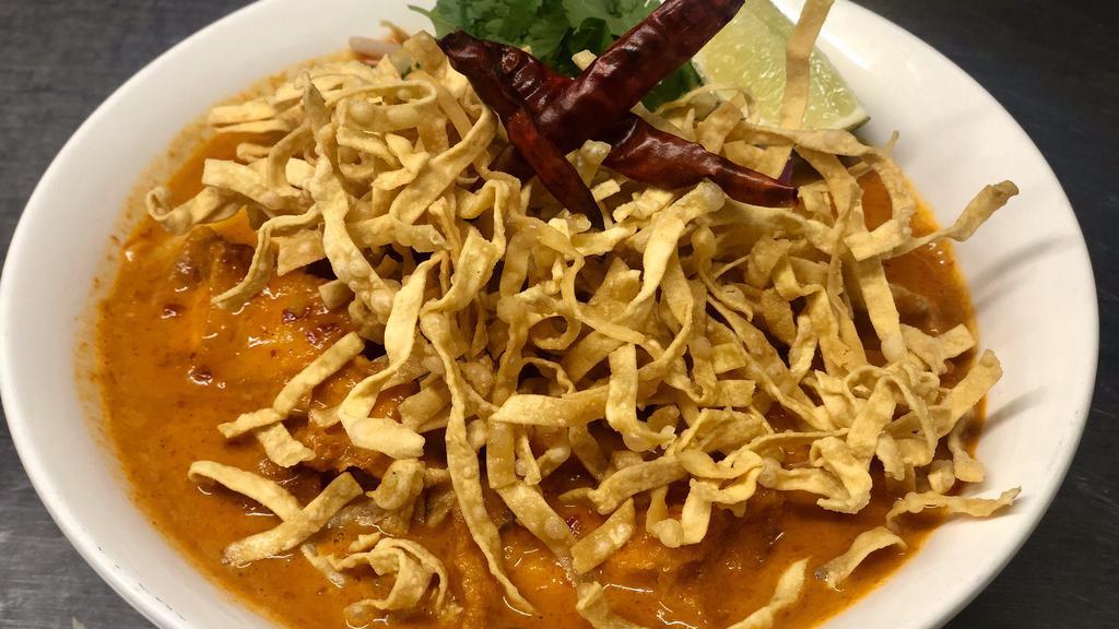 Khao Soi · Thai Northern Style egg noodles in house curry sauce served with vegetable and lime.
