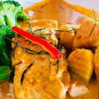 Chu Chee Salmon · Fillet of salmon simmered in aromatic creamy chu chee curry sauce, steamed broccoli, pumpkin...