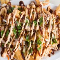 Kamikaze Fries · Fries topped with pork belly, pickled carrots, and daikon, cilantro, topped with mayo hoisin...