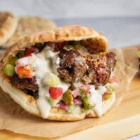 Beef Pita Sandwich by Oren's Hummus · By Oren's Hummus. Chopped beef kebab, hummus, cucumber, tomato, pickles, and tahini in a pit...