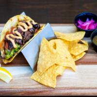 Steak Street Taco · Marinated skirt steak, grilled jack cheese, house-made guacamole, fresh pico de gallo, chipo...
