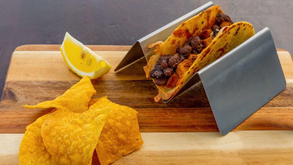 Kid's Steak Taco · Marinated skirt steak, grilled Jack cheese, whole black beans, served on a yellow corn tortilla.