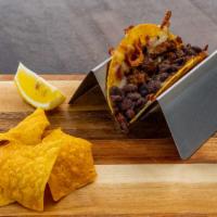 Kid's Chicken Taco · Marinated chicken, grilled Jack cheese, whole black beans, served on a yellow corn tortilla.