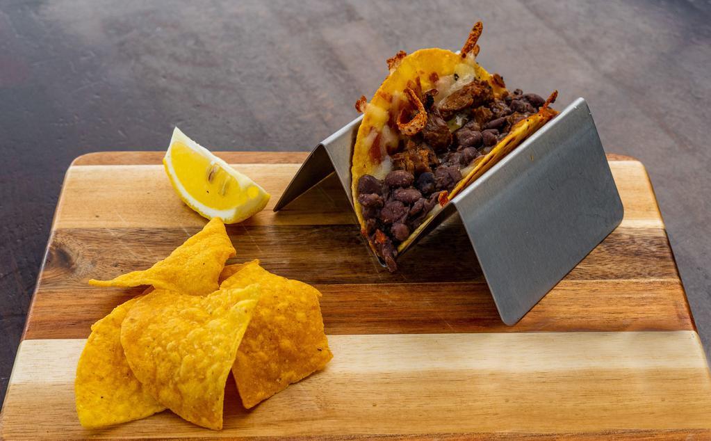Kid's Chicken Taco · Marinated chicken, grilled Jack cheese, whole black beans, served on a yellow corn tortilla.