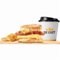 Ham & Egg Biscuit Meal · Rise and shine with our Ham & Egg Biscuit. Savory seasoned sausage and fluffy eggs are layer...