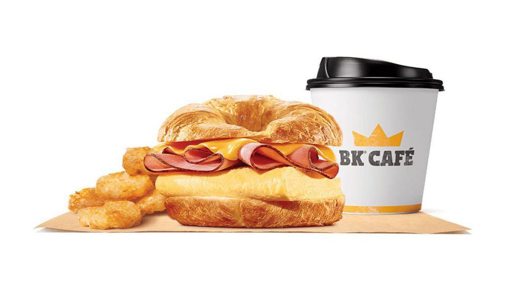 Ham, Egg & Cheese Croissan Wich® Meal · Our grab-and-go Ham, Egg & Cheese CROISSAN’WICH® is now made with 100% butter for a soft croissant piled high with sliced black forest ham, eggs, and melted cheese. Meal comes in medium and large sizes.Served with Hash Browns, your choice of Drink.