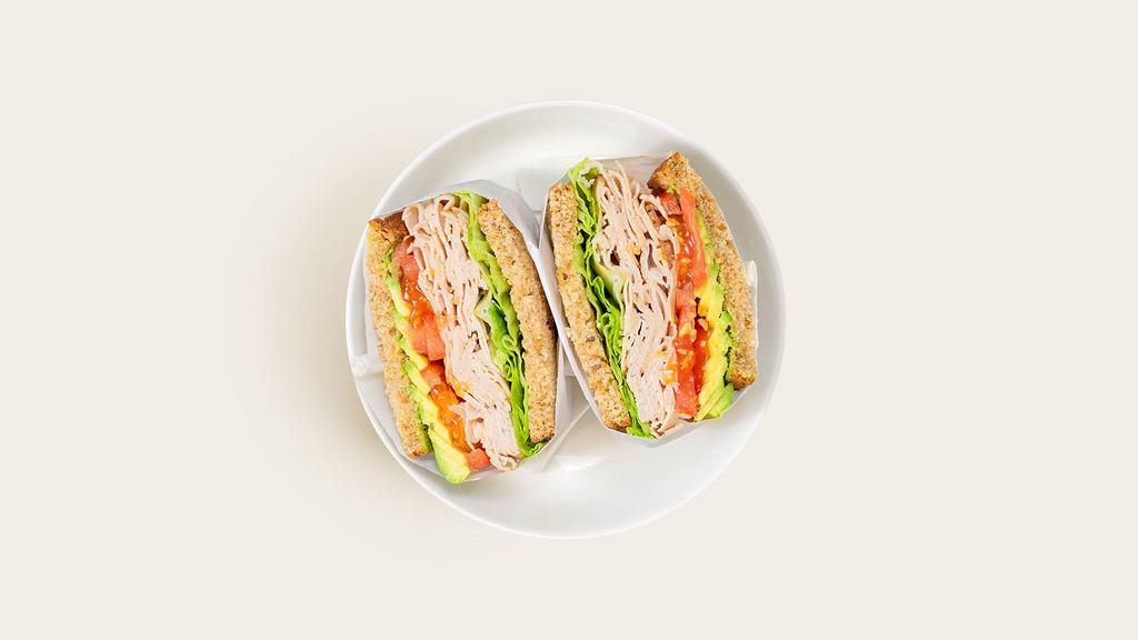 Turkey Sandwich · Sliced turkey with avocado, tomato, lettuce, and bean sprouts on your choice of bread.