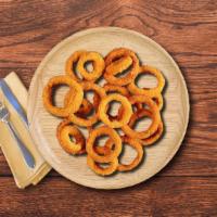 Onion Rings · Double fried crisp & golden, seasoned with sea salt.