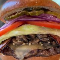 Mushroom Swiss Bacon Burger · Our fresh ground hand pressed 7 ozs. of choice chuck hamburger topped with applewood smoked ...