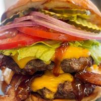 The Knuckle Dragger · Fourteen ounces of beef plus 1/3 pound of applewood smoked bacon. Quadruple cheese, all slat...